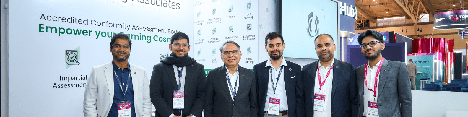 Gaming Associates banner featuring all team members with CEO Dr. Aftab Rizvi, showcasing leadership, teamwork, innovation, and Compliance excellence in the global gaming industry